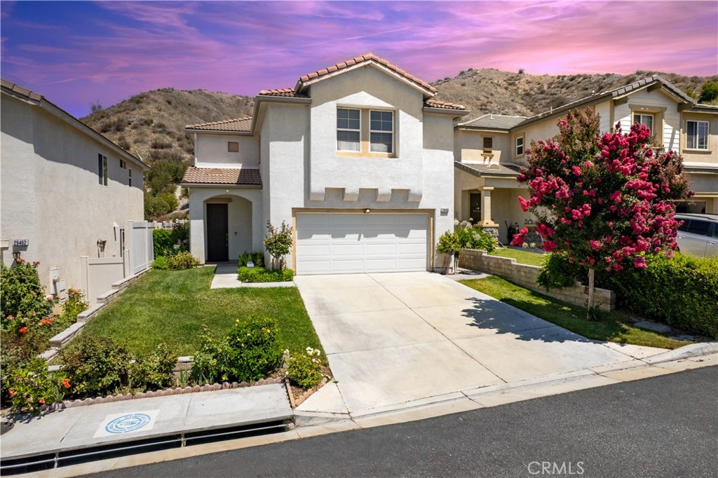 Home on a Quiet Cul-de-Sac nestled in a beautiful and very quiet neighborhood.
Welcome to 29458 Shannon Ct — a beautifully maintained two-story home tucked away at the end of a peaceful cul-de-sac in the sought-after Mint Canyon Community. The home boasts a generous 4 bedrooms and 2.5 bathrooms along with a thoughtful, open-concept floor plan designed for both entertaining or just enjoying a night in.
Step inside to a bright and airy living space featuring hardwood laminate flooring. The formal living room boasts a cozy fireplace and open seating area. The well-appointed kitchen includes corian countertops, a center island, breakfast bar, recessed lighting, a double-door pantry, convention double ovens, built-in microwave, cooktop, dishwasher and refrigerator. The kitchen brings in warm rays bouncing off the beautiful hills.
Outside, you’ll find your own private retreat — a beautifully hard-scaped yard with mountain views, with large planters filled with greenery. A built in gas BBQ that offers vistas of picturesque mountains. Fully landscaped lighting with timers to have the perfect evening ambiance. Plenty of space to host BBQs or build a spa.
Upstairs, a versatile loft includes a built-in office nook, ideal for remote work or study. The laundry room is conveniently located on the same level as the bedrooms allowing for easy access to washer and dryer.
The primary suite is a true getaway, complete with dual walk-in closets, a spa-like bathroom with over sized jetted tub, dual sinks, and separate shower. The Primary bedroom is a large space with plenty of room to cozy up to a book or sink your worries away in the Primary bathtub.
Additional highlights include: Wood Plantation Shutters, Double vanities in bathrooms, Dual walk in closets in primary bedroom, stamped concrete around perimeter of home with landscape lighting with timers which ensure easy maintenance. Ceiling fans, gas fireplace, whole house water filter and more.
No Mello-Roos and a low HOA ($122/mo) make this home even more appealing.
Located minutes from the 14 Freeway, shopping, dining, schools, parks, and College of the Canyons’ Canyon Country campus — this home offers the perfect combination of tranquility and convenience. Come tour it and make this your forever home.