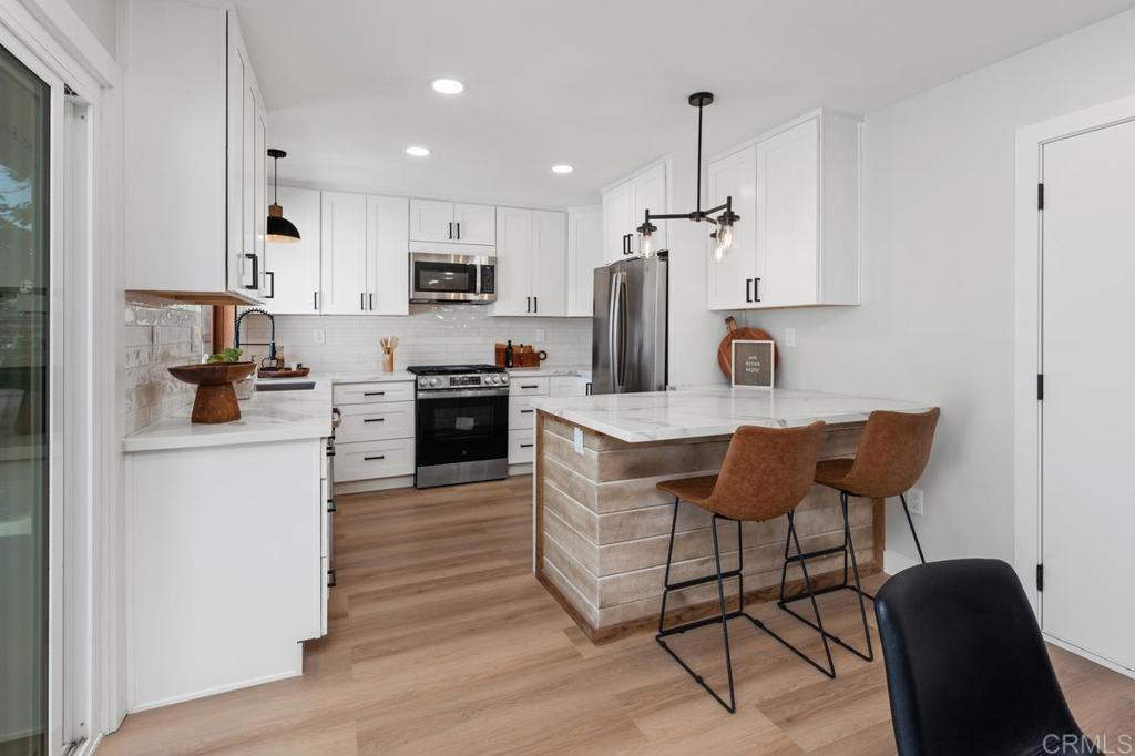 Welcome to 1443 Princess Manor Ct, a beautifully renovated 4-bedroom, 2-bath single story home in the heart of Chula Vista! This home has been fully redesigned with attention to detail, featuring a brand-new kitchen with quartz countertops, stainless steel appliances, and modern finishes, updated bathrooms, and modern technology for convenience. Enjoy a sanctuary-like backyard perfect for entertaining or relaxing, surrounded by lush landscaping that enhances privacy and curb appeal. The two-car garage provides ample space for vehicles and storage. Every corner of this home reflects style, comfort, and functionality—move in and enjoy a fresh, modern living experience!