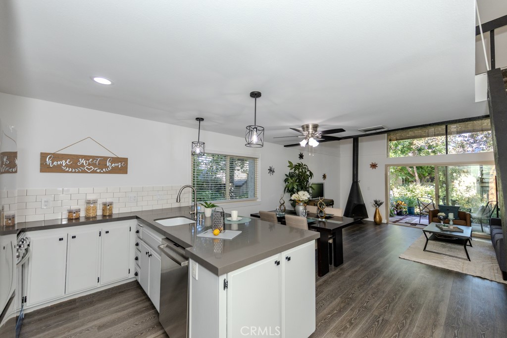 Highly Desirable End Unit, Light and Bright, Open Floor Plan, Cathedral Ceilings, No One Above or Below You. Relax and Enjoy the View of Ponds and Sounds of Trickling Water from this Charming Condo! Have Your Morning Coffee Overlooking the Streams and Walking Bridge, Surrounded by Nature and Lush Foliage from Your Patio. It's Great to Way to Start Your Day as You Take in the Serenity Nestled in this Wonderful Little Tree-Lined Hideaway Filled with Waterfalls, Lakes and Streams Giving You the Feel of a Mountain Escape. Enjoy the Peaceful Views of Nature in this Charming 1 Bedroom & 1 Bath Loft Style Condo . Walk-in closet, Upgraded Double Pane Windows and Sliding Glass Door. Remodeled Kitchen with Quartz Countertops, Laminate Wood Flooring, new stainless steel appliances, Dishwasher, Oven and Refrigerator. Breakfast Bar in the Kitchen With a Great View of All This Natural Beauty. Cozy Up With a Unique Wood Burning Fireplace. Also, comes with forced Air Heating and Central Air Conditioning. This Unit is One of the Best Locations in the Complex Only Steps Away From Laundry Room and Mail Room and Parking. Other Featured Amenities Include Tennis Courts, Sauna, Pool and Spa.This Certified Wildlife Habitat has Ducks, Squirrels,Turtles, Koi Fish & an Occasional Egret. You'll Find Walking Paths Throughout with Breathtaking Views of Nature Without Ever Having to Leave Your Complex. Welcome to Orange Lakes! Close to Shopping, Dining, Peter’s Canyon, Old Town Orange and Disneyland. Absolutely A Must See!!