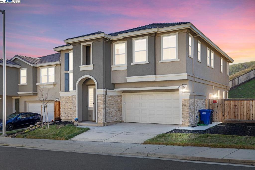 **Discover Capri at San Marco!** Nestled in the beautiful rolling hills of Pittsburg’s most sought-after communities, this remarkable home invites you to experience serene living and cherished privacy. Featuring 5 bedrooms and 4 bathrooms, the open floor plan welcomes an abundance of natural light, creating an uplifting atmosphere. The stylish grey shaker cabinetry, complete with satin nickel pull knobs and soft-close doors, beautifully enhances the kitchen, complemented by modern stainless steel appliances. The grand staircase, adorned with wrought iron balusters, adds a touch of elegance to the space. Additional highlights include upgraded granite slab countertops, durable luxury Vinyl flooring and carpet upstairs, a tankless water heater, and a garage prepared for electric vehicle charging. With soaring 9' ceilings and a solar-owned energy system, this residence embodies a commitment to both luxury and sustainability all sitting on an extra-large lot. Embrace the opportunity to create lasting memories in this extraordinary home and let your dreams unfold!