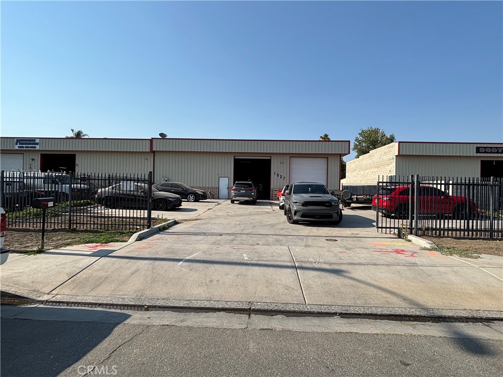 This ±4,000 square foot light industrial building offers a flexible combination of office and warehouse space, ideal for owner-users or investors. The interior features ±1,000 SF of office space, including three private offices and an open loft overlooking ±3,000 SF of warehouse/storage. With two oversized 12’w x 14’h roll-up doors, 400 AMP 3-phase power, HVAC in all areas, and full insulation, the property is designed for functionality and comfort. Additional highlights include a secured lot with wrought iron fencing and rolling gate, 7 on-site parking spaces, a restroom, and concrete driveways for easy truck access. Situated on a 10,018 SF lot and delivered vacant, this 2006-built facility is ready for immediate occupancy.