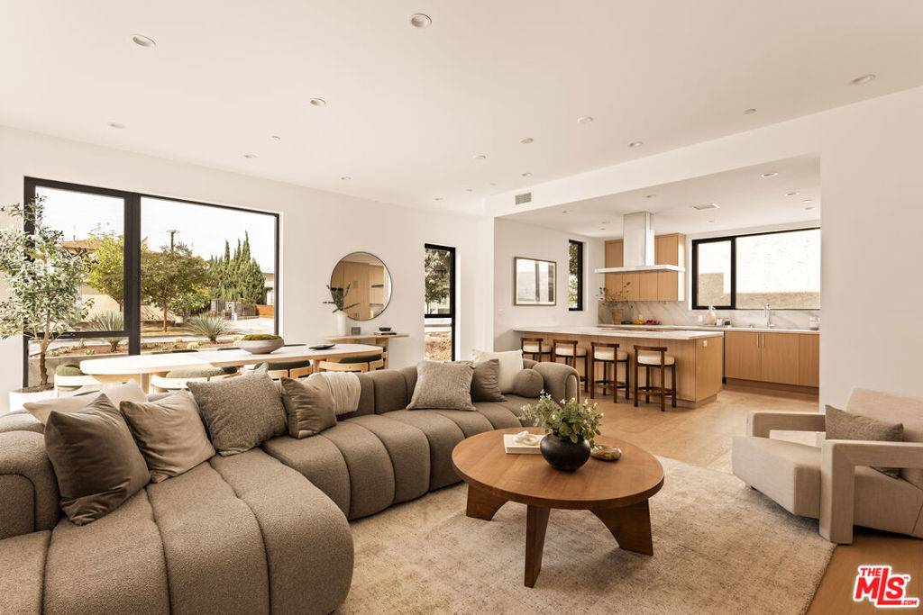 Nestled in the heart of Santa Monica's sought-after Sunset Park neighborhood, Trio is a collection of three architecturally refined townhomes, minutes away from some of the best lifestyle and leisure Los Angeles has to offer. Thoughtfully conceived and meticulously built, each residence showcases a harmonious blend of warm, natural materials and modern craftsmanship. Interiors are defined by voluminous open-plan living spaces, where expansive walls of glass invite natural light to pour in, blurring the boundary between indoors and out. Custom kitchens serve as the centerpiece of each home, featuring professional-grade stainless steel appliances, sculpted stone countertops, and breakfast bars that combine form and function with effortless elegance. Upstairs, the private living quarters include three-bedroom suites, comprised of a primary retreat with a spa-inspired bath, dual vanities, and a walk-in shower designed with refined simplicity. Completing each home is a flexible office or studio space and a private attached garage, adding both convenience and versatility. Trio embodies the best of contemporary coastal architecture and elevated living, just moments from Santa Monica's acclaimed dining, boutique shopping, and the iconic beach and pier.