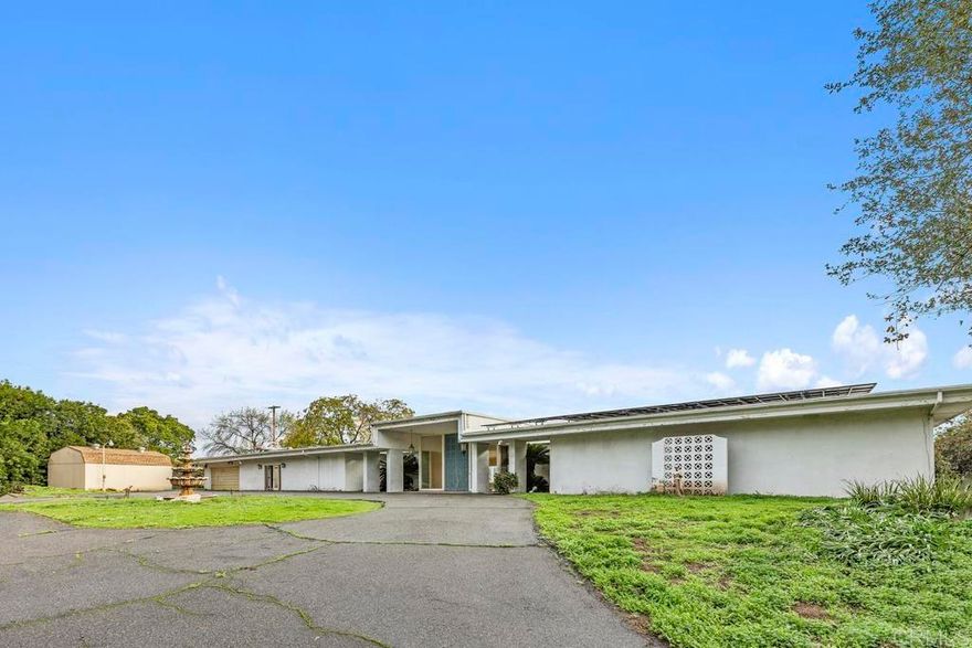 Opportunity awaits! Discover a rare chance to own a sprawling 4,040 square foot, single-story home nestled on a picturesque 1.34-acre lot. This property boasts a park-like setting with expansive valley views, offering peace, privacy, and beautiful natural surroundings. Home Features • Bedrooms: 3 spacious bedrooms, including a main bedroom suite • Bathrooms: 4 well-appointed bathrooms for ultimate convenience • Living Spaces: Great room, dining room, and living room, perfect for entertaining and comfortable family living • Fireplaces: Multiple fireplaces throughout the home add warmth and charm • Outdoor Living: Enjoy an inground pool, ideal for relaxing or hosting gatherings, all while taking in breathtaking valley views Endless Potential This home presents a unique opportunity for remodeling, redesigning, or development to suit your personal taste or investment goals. Whether you envision updating the existing layout, creating a modern open-concept space, or expanding further, this property is ripe with possibilities.