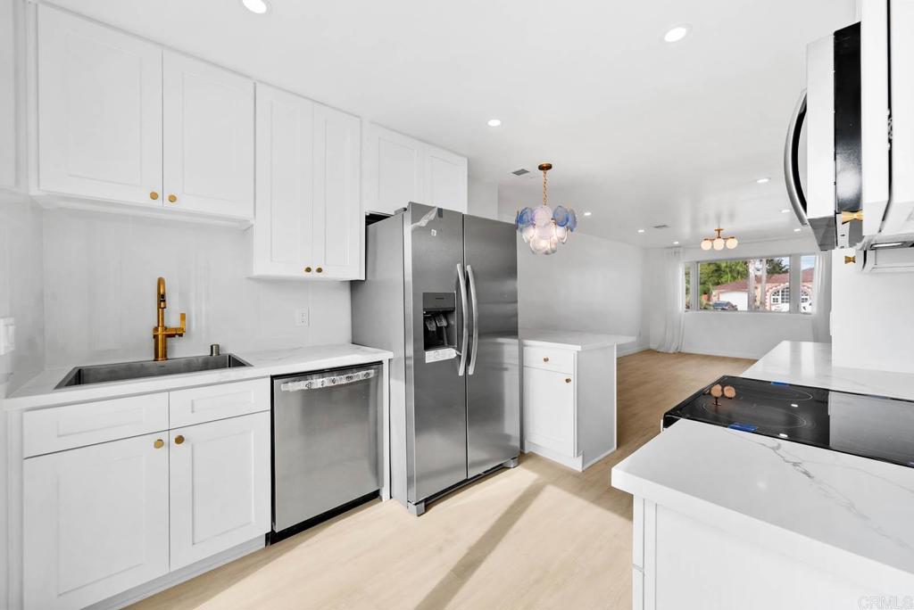 Rare opportunity in Imperial Beach! Fully remodeled 3BD/2BA home, taken down to the studs and rebuilt with all-new electrical, plumbing, roof, appliances, water heater, Andersen windows, flooring, doors, fixtures, and more. Features a modern open-concept layout with new kitchen, pantry, and a primary suite with dual-sink bath. Indoor laundry, EV charger, new garage door, and fresh landscaping complete the turnkey package. Comes with city-approved & paid plans for a 1,200 sq. ft. ADU with easy driveway addition. Enjoy the prime location just minutes from the beach, as well as shops, dining, and schools—all while having the added benefit of approved ADU plans. This is the perfect combination of coastal lifestyle, turnkey comfort, and long-term value. Full list of upgrades in Documents.