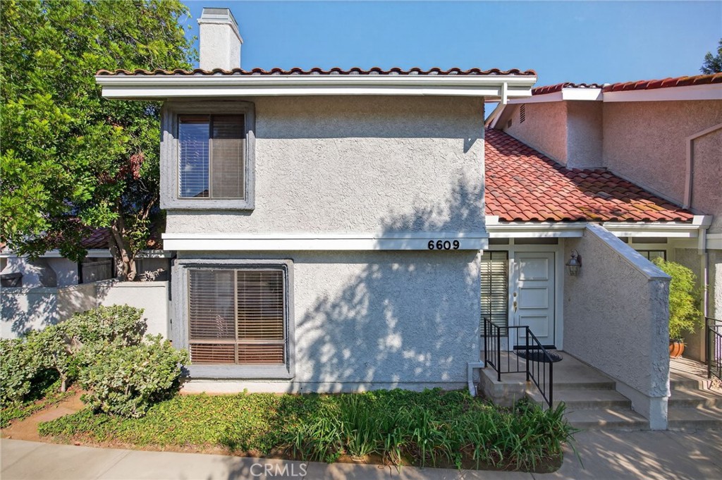 Welcome to 6609 Poppyview Drive nestled in the sought after community of County Village which is in the Oak Park area of Agoura Hills. Upon entering this lovely townhome you are greeted by the large living room with a beautiful fireplace that is open to the dining area. There is a mix of stone and beautiful wood flooring throughout the lower level including the kitchen and eating area.There are 2 separate sliding doors for access to the patio with lots of entertaining space. Upstairs you will find the spacious private primary suite with 2 closets and an upgraded ensuite that has a walk-in shower and double sink vanity. Take a look at the hidden medicine cabinets behind the mirrors!!! One of the secondary bedrooms has access to the very large patio for additional outdoor space for your gardening or relaxation. The direct access large 2 car garage has epoxy floors, lots of cabinets and includes the washer and dryer. Across the street is one of the community pool areas, so convenient!!! It's a great location with close proximity to award winning schools, parks, trails and beaches.