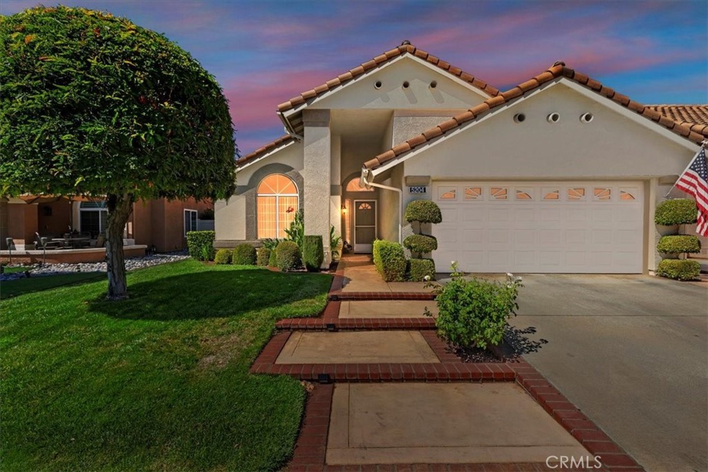 Welcome to Sun Lakes, the community that offers active 55+ individuals a wonderful safe place to live and enjoy the lifestyle they deserve. From the moment you pull up to your new home you can see the pride of homeownership in this beauty. From the well-manicured front yard, the brick trimmed steps that lead to the front door to the pristine outside paint, this home is inviting. Once you walk through the door you will notice the dwelling calls you in providing a calm and comfortable space for you to enjoy. The formal living room has rich lighter tone carpet, wood flooring, and it adjoins the formal dining room that has vaulted ceilings and a chandelier. The kitchen's space flows nicely to the open area of the family room that has a cozy fireplace. The main bedroom is situated in the rear of the home with direct access to the back yard. The main bedroom also has "his and hers" closets and a smart functional main bath with separate latrine and shower area. The guest bedroom is over sized providing plenty of space for a bed and office/craft room. This room has lots of natural light. Relax in your gorgeous backyard that is built for pure relaxation with a sprawling alumawood patio, mature plants and space for patio furniture. Sun Lakes community has one inside and two outside pools, 2 golf courses: a Championship course and an Executive Par 4 course, a restaurant, pub, billiards room, gym, pickleball, tennis courts, daily activities and more. Additional home features include new outside paint, new alumawood patio cover with lighting and ceiling fans, Corian kitchen counters, farm sink, berber carpet, 2 car, plus golf cart parking and more!