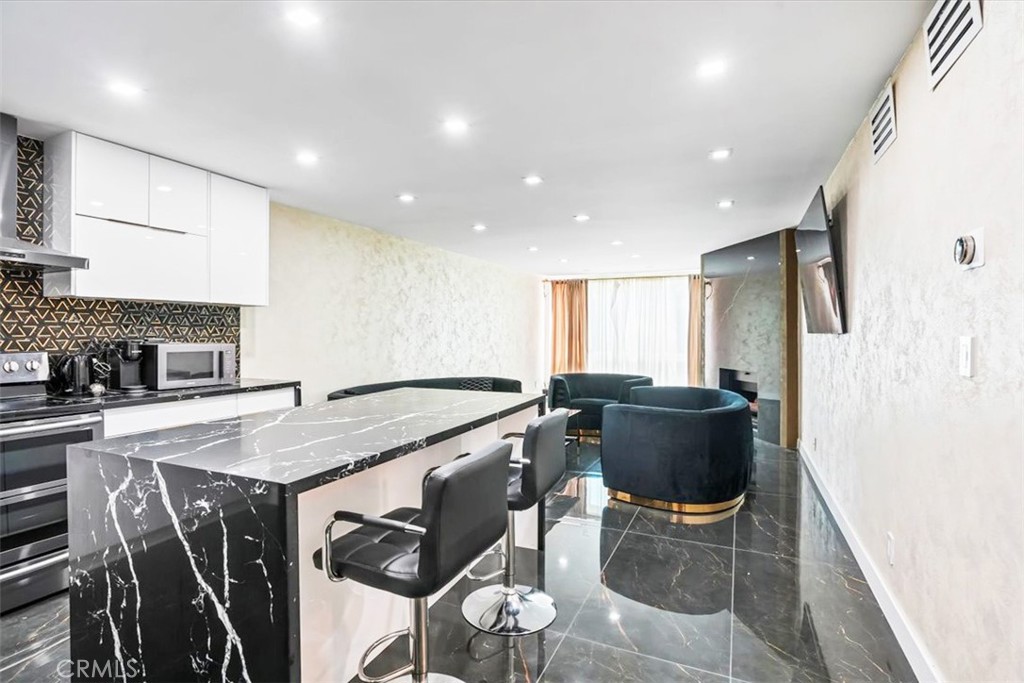 Beautifully upgraded one-bedroom, one-bathroom condo in the highly sought-after Briarcrest community in Valley Village. This bright unit offers an open floor plan with excellent natural light, treetop views, and a spacious living room featuring a cozy gas fireplace and a bonus office nook. The home has been completely renovated throughout, including a stylish kitchen with stainless steel appliances and a sleek center island that flows seamlessly into the living area, perfect for modern living.
The generous bedroom features a large walk-in closet, and plenty of additional storage. This home includes its own private laundry room, one of the few units with this convenience. Located on the first floor, it also comes with a designated parking space and overhead storage.
Briarcrest is a gated, well-maintained complex with resort-style amenities, including a sparkling pool, spa/hot tub, fitness center with saunas, a recreation room, additional storage, and beautifully landscaped grounds. Conveniently located near shopping, dining, houses of worship, Valley College, and NoHo West.