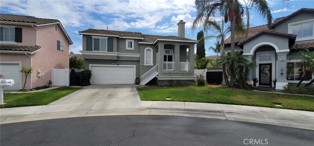 Beautifully upgraded home in Corona Ranch Terrace! Located on a quiet cul-de-sac with one of the largest lots, perfect for entertaining, gardening, or adding a spa/gazebo. Upgrades include a new 6' vinyl privacy fence all around the property, double-pane windows, and a secure double-lock entry screen door. Inside: soaring ceilings, granite countertops, newer appliances, lots of windows that provide abundant sunlight, and updated bathrooms with modern vanities and glass enclosures. Convenient upstairs laundry. The finished 2-car garage offers built-in cabinets and an epoxy-coated floor. Close to the 91 & 15 freeways, shopping, dining, and all amenities are nearby, like Costco, Vons, and Walmart Shopping Center. Also within walking distance to the highly rated Corona Ranch Elementary. A must-see!