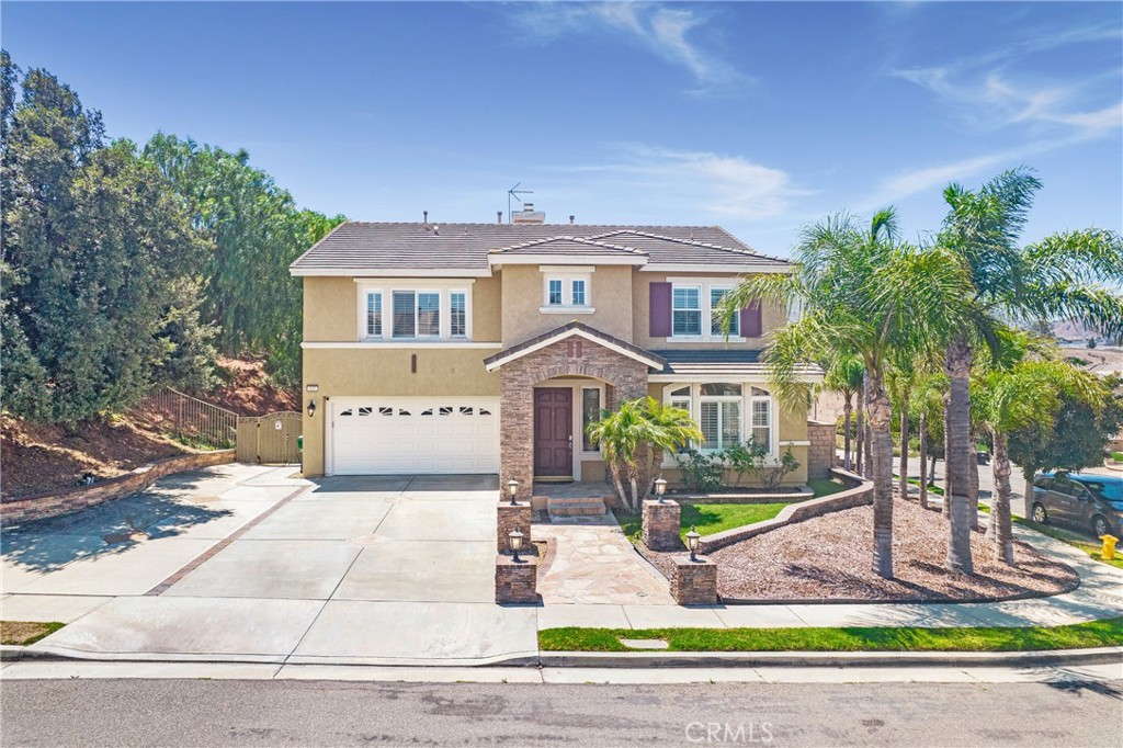 Stunning Home in the Foothills of Corona, California. Nestled in a tranquil community of just 16 homes, this beautifully updated four-bedroom, 2.5-bath residence offers the perfect blend of luxury and comfort. Located off Green River, just one exit from Yorba Linda and with convenient access to the 91 freeway, this home boasts stunning mountain views and a serene atmosphere. Spanning 3,274 square feet, the open and airy floor plan features a spacious living area with a warm fireplace, ideal for cozy evenings. The recently remodeled kitchen showcases modern finishes, complemented by elegant plantation shutters, crown molding, and recessed lighting throughout. The wrought iron staircase adds a touch of sophistication, leading to four generous bedrooms designed for relaxation and serenity. Ceiling-mounted speakers enhance the functionality and comfort of this stunning home.Located close to Metro Lake and surrounded by nature, this property is perfect for those seeking both adventure and convenience. Don’t miss the opportunity to make this exceptional home your own.