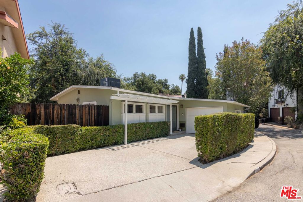 Nestled in the tree-lined foothills just south of South Pasadena High, 842 Oneonta is a hidden haven. A quaint early mid-century style design from the late 40s, this 2BD/1BA home feels warm, classic, and welcoming. Natural light streams into every room through the many large windows & glass doors which also frame views of the green hillside setting. The living room & kitchen are accentuated by high loft-esque beamed ceilings which allow for a roomy & open feel. Access to either of the two patios from any room in the home brings the surroundings inside and helps create an extended indoor/outdoor flow. Features of this home include a newer HVAC system, stainless steel appliances, parking for two cars (one in the garage), and an installed washer and dryer. And South Pasadena schools! Square footage has been taped (and previously sold) at 800 sq.ft. - buyer to verify.