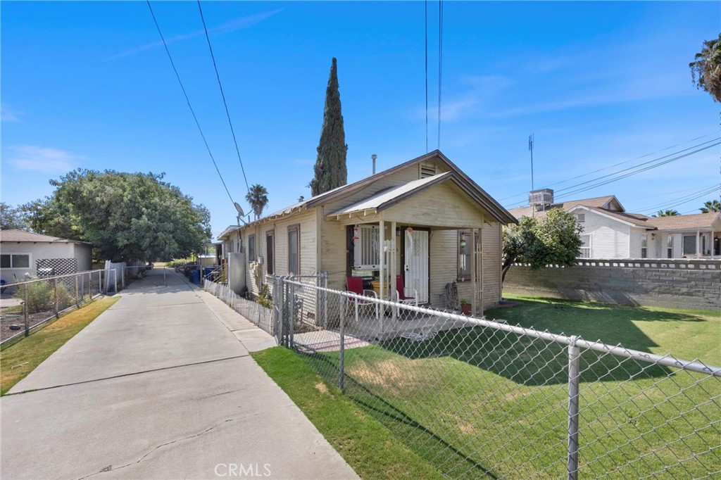 Two homes for the price of one! Extraordinary opportunity to own this fine 3+1 home SFD and 3+2 mobile home on one lot, the front home offers a comfortable living room, wall furnace, spacious bedrooms, jack n jill bathroom layout, comfy kitchen and seperate laundry room, (stay tuned for pictures of additional two bedrooms in front house) , light cosmetic fixer, this will make a perfect home for a small family - this parcel is zoned R2 and has a completely seperate living quarters (mobile home) in rear yard, both dwellings have seperate gas meters and seperate power meters - they are also seperated by a chain link fence which provide complete privacy for each occupant, the long concrete drivway accomodates parking easily - these fine dwellings are seeking a new homeowner to call the "Home Sweet Home"! Call today to schedule a private tour!