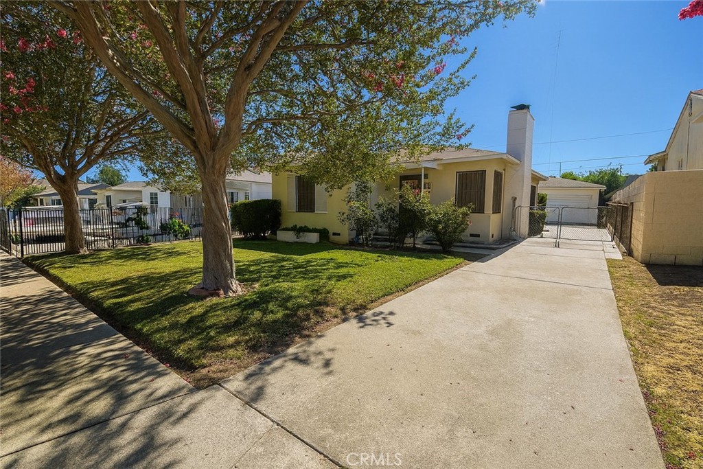 Welcome to 2486 Belle Street, a charming home nestled on a tree-lined street in the heart of San Bernardino. This 2-bedroom, 1-bath residence offers 885 sq ft of well-designed living space on a generous 5,040 sq ft lot. From the moment you arrive, the home's welcoming curb appeal and mature landscaping set the tone for its potential. Step inside to a light-filled living room featuring a cozy fireplace and large picture windows. The floor plan flows into a defined dining area and a character-filled kitchen with original details and ample storage. Both bedrooms are comfortably sized, and the home also offers an indoor laundry room for convenience. The elongated side driveway provides ample parking and leads to a detached 2-car garage—ideal for RV access, a workshop, or potential ADU conversion. With its functional layout and classic bones, this home is a wonderful opportunity to reimagine and make your own. Beyond the home, enjoy a vibrant lifestyle with Downtown San Bernardino and the University District just minutes away—offering cultural venues, cafes, Cal State University San Bernardino, and a growing arts scene. Outdoor enthusiasts will love being close to Glen Helen Regional Park, with its scenic lakes, hiking trails, and amphitheater, and only a short drive to the breathtaking San Bernardino Mountains, offering year-round adventure from hiking to skiing. Whether you’re a first-time buyer, investor, or someone with a vision, 2486 Belle St is ready to be transformed into something truly special.