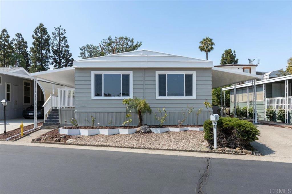 Freshly remodeled home located in a 55+ park with rent control and beautiful amenities! This home features a spacious Living room, formal Dining room, and an additional Family room / Den that is open to the beautifully remodeled Island Kitchen, plus two primary bedrooms, each with it's own ensuite remodeled Bathroom! Both Bedrooms feature a walk in closet. The main Bathroom features double sinks and a large custom shower! The home also boasts new exterior paint, new dual pane windows, LVP floors throughout, quartz counter tops, new exterior doors, new recessed lighting and fixtures, new stainless steel appliances, and so much more! The exterior has one storage shed, a covered porch, and a low maintenance yard. This rent controlled community has a clubhouse, a pool that is heated year round, jacuzzi, billiards, library, shuffle board & a dog park. Conveniently located near Costco, Walmart, Kohls, grocery stores, dining, public transportation, both the Palomar Hospital and new Kaiser hospital & medical offices, and more! Low space rent of only $710.70 per month. One resident must be 55+, while the second resident can be 40+. One indoor pet under 25 lbs is welcome with prior management approval.