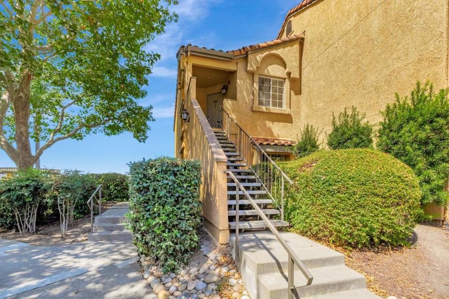 PRICE REDUCED!  Welcome to this charming Mediterranean-Inspired Retreat with Resort-Style Living in a well-maintained gated community. Immerse your senses with a daily dose of Million-Dollar Sunset and Night-Time Views overlooking the Canyon Lakes Golf Course and hillside views. This 2nd floor end unit features an open floor plan with LR, DR, Kitchen, in-unit Laundry, a spacious Master Suite with two closets: walk-in closet & a smaller closet, large 2nd BR with roomy closet. The kitchen is equipped with electric oven/range and refrigerator, making meal preparations a breeze. The home features newly installed water-resistant vinyl and new Carpet, providing a cozy atmosphere. A central A/C system ensures year-round comfort on Hot days, while the central forced air heating system keeps the chill at bay. This gated community features two luxurious outdoor pools, three jetted spas, sauna, a gym and two elegant Clubhouses.  A pergola, conveniently located outside the end unit, is ideal for entertainment. The San Ramon Valley offers Top Rated Schools: Golden View Elementary, Iron Horse Middle & CA High School. Easy access to ClubSport, Whole Foods, Iron Horse Trail, the Bridges Golf Course & Crow Canyon Country Club. Parking Spaces: 91 & 43. Don't miss this opportunity to make it yours!