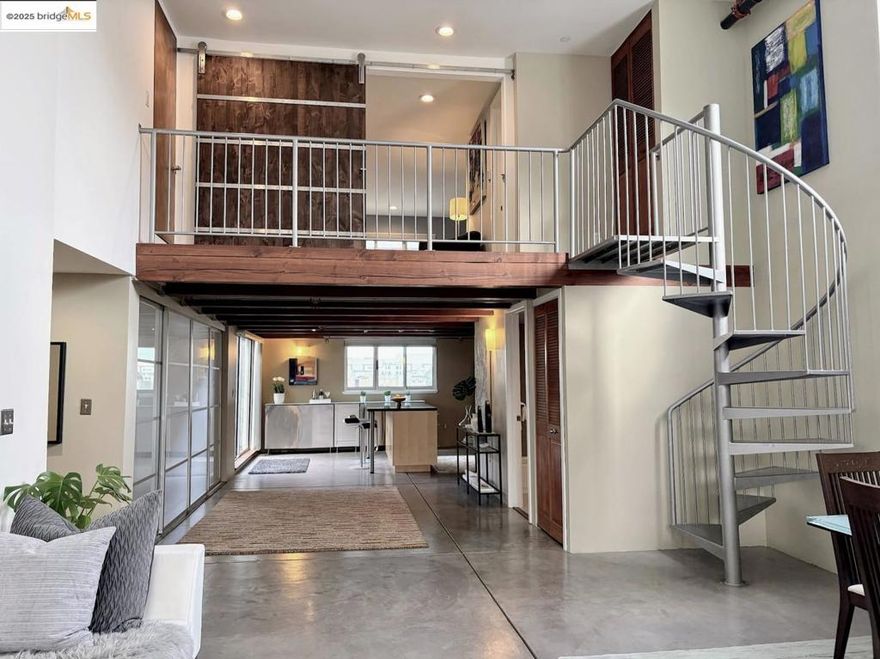 Luxurious 2 bedroom, 2 bath live/work loft in sunny Potrero Hill, located at 22nd St. with convenient access to the heart of SF’s vibrant Dogpatch neighborhood. Captivating 14+ foot ceilings and expansive windows bathe the end-unit home in natural light. The entertainer’s kitchen features granite countertops, spacious island, stainless-steel refrigerator, new smart range and dishwasher, and exposed wood beams. A sliding glass door leads to an exclusive-use courtyard, ideal for indoor-outdoor living. The open-concept main level impresses with polished concrete floors, cozy bedroom, full bath, laundry, and generous office space. The spiral staircase ascends to a large primary suite, complete with a stylish barn door, en suite bathroom adorned with a quartz countertop, abundant closet space, partial bay view, and no side neighbors. Enjoy 1-car garage parking & dedicated storage closet. Parks, shops, restaurants, bars, public transportation, and I-280 are nearby.