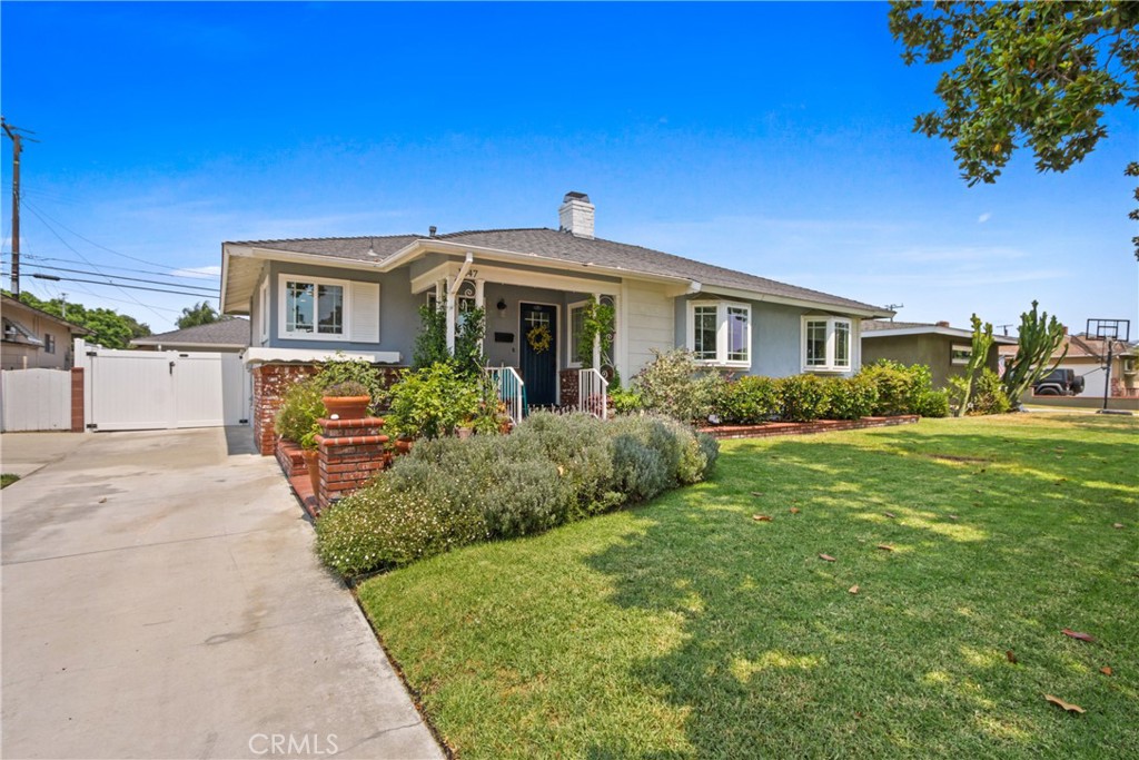 Welcome home, this charming 3-bedroom 2-bath home sits on a quiet street in a quaint neighborhood in Fullerton. The cozy living room has a fireplace and looks out to the covered patio and spacious backyard that is filled with beautiful flowers and landscaping. The backyard is perfect for entertaining or just sitting and relaxing. Inside, you have a primary bedroom with a bathroom, two other guest bedrooms, and a guest bathroom. The kitchen has been updated and has two pantries and plenty of cabinets, and storage. Located just minutes from downtown Fullerton and Fullerton City College, and Cal State Fullerton.