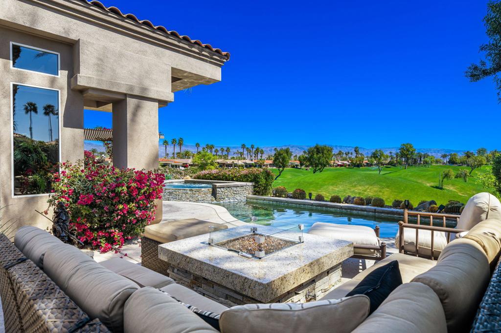 Private Pool/Spa, Casita, Double Fairway Views and GOLF Membership available to Buyer with no wait! This updated Palo Verde 3G is elevated with long double fairway views of Grove #'s 14 & 15 at Indian Ridge CC. Offered Turnkey Furnished with OWNED Solar (installed in 2023). This 4 bedroom home includes a detached 1 bedroom/1 bathroom Casita off the large front courtyard. Expansive and private course and mountain views! Fairway patio features a pool & spa with water feature, covered built-in BBQ area, and a generous seating area with fire table...great for entertaining! Open floor plan - living room, dining room, wet bar, family room & dining room...all share the same great views. Dining room looks out to the front courtyard & opens to the great room. Family room opens to the kitchen & patio by BBQ area. Kitchen features granite countertops and stainless appliances. A separate Wine Closet is in the hall just off the kitchen. The Primary Suite is a luxurious retreat with 2 closets (1 a large walk-in). Ensuite bathroom features granite counters, dual sinks, tub & separate shower. The 2 guest rooms are en suite and offer great privacy for your guests (one is currently used as office). Detached Casita includes 1 bedroom + ensuite bathroom. Close to the clubhouse, this home is a cart ride to the sports club, tennis & golf. HOA monthly dues include security, cable & internet, all gardening, exterior paint, roof maintenance, exterior water, exterior pest control and trash. Indian Ridge CC features two Arnold Palmer Signature golf courses, tennis/ pickleball facilities, a fitness center, a full-service spa, two restaurants, 38 community pools/spas & active social calendar. Come and join the fun!