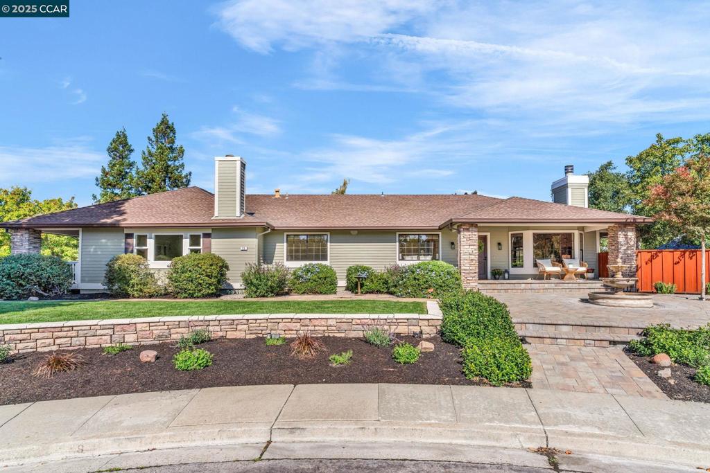 Stunning Single-Story Home in Coveted Tassajara Ridge, perfectly situated on a peaceful court with a charming wrap-around covered porch invites you to relax and take in the serene surroundings—perfect for morning coffee or starlit evenings. Inside, the home features a spacious formal living and dining room with a striking rock fireplace with gas starter and French doors leading to the porch, seamlessly blending indoor and outdoor living. The updated kitchen showcases quartz countertops, bar seating, new cooktop & hood, hardwood floors, a large pantry, and a cozy breakfast nook with access to the covered porch. Luxurious Primary Suite is a tranquil retreat with sliding glass doors that open to the porch, walk-in closet, recessed lighting, and a beautifully updated bathroom suite featuring a soaking tub, glass-enclosed shower, & dual-sink vanity.Two spacious secondary bedrooms share an updated bathroom with quartz countertops. The expansive great room impresses with vaulted ceilings, French doors to proch, fireplace, abundant natural light—ideal for entertaining and gatherings. Enjoy the thoughtfully designed backyard with a large grassy area, a large garden box, gazebo, and built-in BBQ. There’s ample space to add a pool or even an ADU- endless possibilities. OH Fri 5-7, Sat & Sun