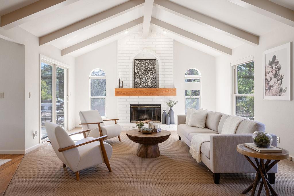 Tucked away on a serene .38 acre corner lot in Emerald Hills, this 4 bedroom, 3 bathroom estate offers 3,157 sq ft of refined living in a private cul-de-sac. Framed by mature landscaping and fresh exterior accents, the home exudes timeless curb appeal and exceptional privacy. A covered front patio and double door entry open to a soaring vaulted foyer with light filled interiors. The elegant living room with grand fireplace flows to a formal dining area, while the updated kitchen features refinished cabinetry, granite countertop, stainless steel appliances, and a charming garden window. A sunny breakfast nook and vaulted family room with dramatic brick fireplace create the perfect gathering space. Upstairs, the spacious primary suite boasts mountain views, a custom walk-in closet, and spa-like bath with soaking tub, dual vanities, and a separate shower. Three additional bedrooms and a renovated bathroom complete this level. Additional highlights include a full main level bathroom and an oversized 2-car garage with built-in storage.The private backyard retreat includes a sun deck with jacuzzi, pergola lounge, and space for a garden or outdoor kitchen. Nestled in picturesque Emerald Hills, this home offers a peaceful retreat while providing easy access to all parts of the Bay Area.