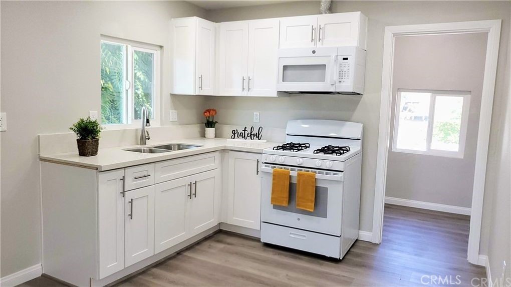 Welcome to this remodeled and gated duplex located at 21786 Cottonwood Ave in Moreno Valley. This 2-bedroom, 1-bath unit offers an open floor plan with recessed lighting and laminate flooring throughout. A brand-new A/C and heating system provides year-round comfort, and the convenience of in-unit washer and dryer hookups makes daily living easy. Ideally situated in the Edgemont neighborhood, this home is just minutes from Costco, Target, the Moreno Valley Mall, and a variety of dining options. Commuters will appreciate quick access to the 215 Freeway, nearby Metrolink station, and local transit options. Families will find schools, including Edgemont Elementary, Sunnymead Middle, and Moreno Valley High, within close proximity. Combining modern upgrades with a central location, this home is a great choice for those seeking comfort and convenience.