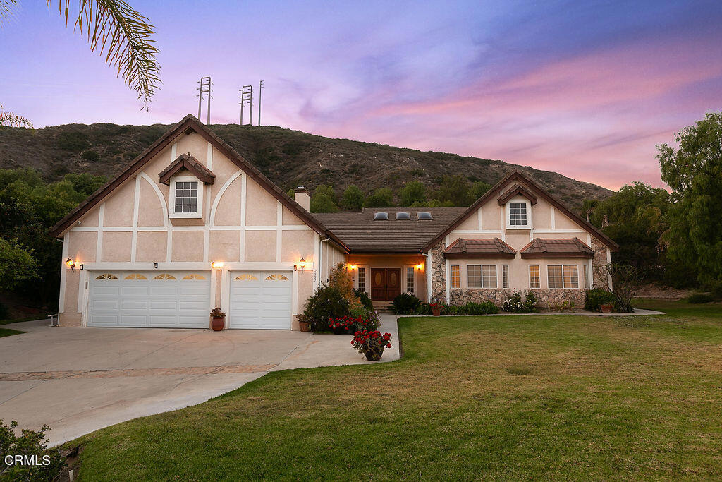 Welcome to this single-story home, offering over 3,700 square feet of elegant living space and a spacious 3-car garage. Situated on just over an acre of beautifully landscaped grounds in a prestigious gated community, this residence is nestled at the end of a quiet cul-de-sac in the sought-after Santa Rosa Valley.Inside, you'll find sun-drenched rooms with soaring vaulted ceilings and strategically placed skylights that highlight the rich wood and stone flooring throughout. The thoughtful floorplan includes 4 bedrooms, expansive formal living and dining rooms, a cozy family room, a breakfast nook, and inside laundry room.The expansive primary suite is a true retreat--complete with a sitting area, French Doors, fireplace, and a custom walk-in closet. The spa-inspired ensuite bath adds to the luxurious feel.For those who love to cook or entertain, the gourmet kitchen is a dream come true. Outfitted with cherry cabinetry, a large center island, granite counters, built-in side-by-side refrigerator, six burner stainless steel free-standing range, with built-in double ovens, this kitchen is the heart of the home.Designed for both comfortable living and stylish entertaining, this residence seamlessly blends warmth, space, and functionality. Enjoy privacy, prestige, and the natural beauty of Santa Rosa Valley--all in one exceptional package.