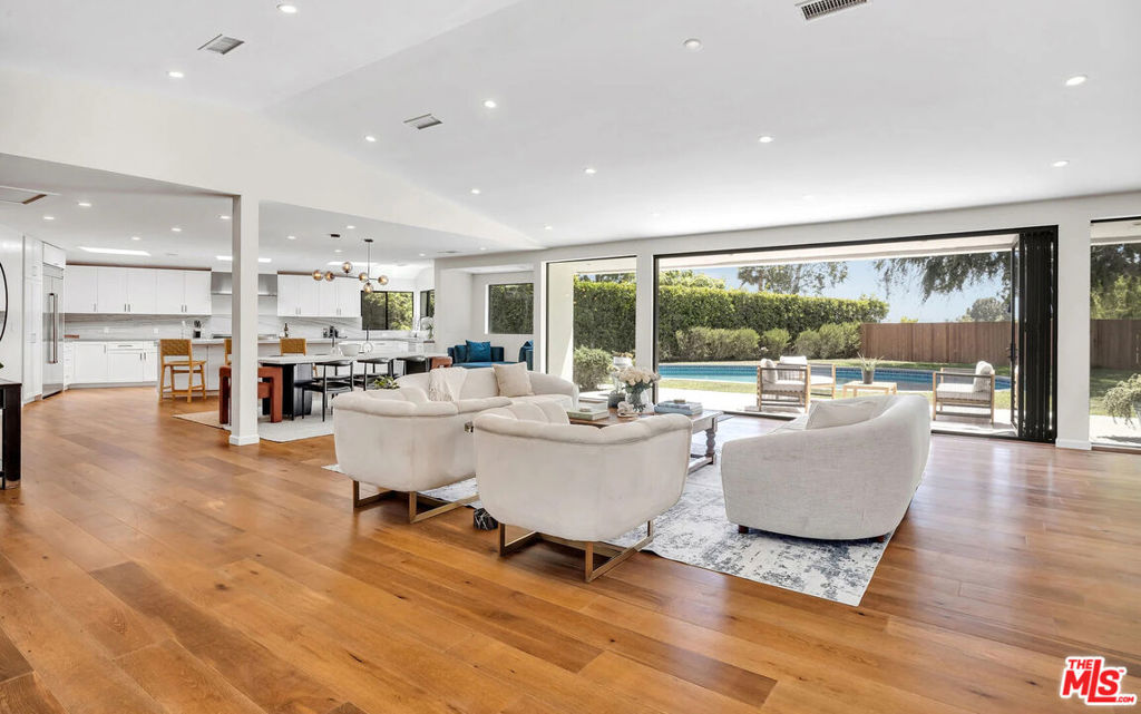 Located in prestigious Bel-Air, near coveted Roscomare Elementary, this fully-furnished fabulous single story Contemporary home has been completely remodeled from top to bottom. Featuring five ensuite bedrooms with generous sized closets, there is a bright and airy feel throughout. It is situated around a large pool on a 16,500 SF lot with a great view. The entire living room wall opens up for sophisticated indoor/outdoor living. A great backyard with a large grassy area for barbecues and entertaining. European Oak Floors, Top of the line Jenn Air Appliances, Toto Neo Rest Toilet, New HVAC system, Filtration System and Nest Thermostats are just a few of the amazing new features! The landscaping has also been completely redone along with new security gates.