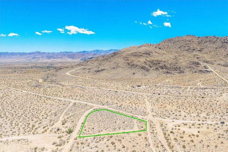 Discover the perfect canvas for your desert dream retreat on this 1.89-acre parcel in Joshua Tree. This expansive lot offers wide-open space and breathtaking panoramic views of the surrounding desert landscape and mountains. Just a short drive to Joshua Tree National Park and local amenities, this property is ideal for building a custom home, vacation rental, or peaceful getaway. Buyer to verify all utilities and zoning.
