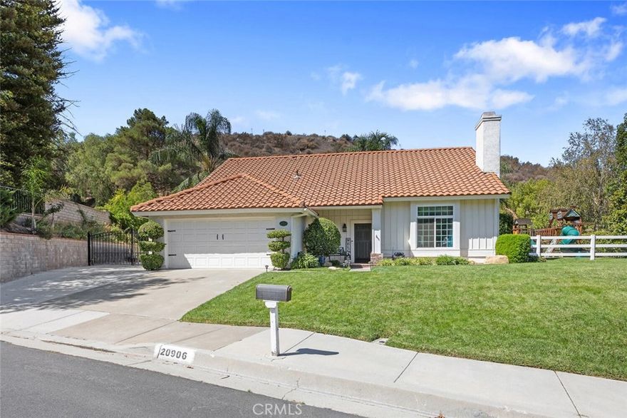 TENNIS ANYONE? This incredible Saugus home features not just RV Parking but a full size, lighted Regulation TENNIS COURT! Tucked away on a quiet cul-de-sac is the unique Saugus home on nearly 40,000 sq ft of private grounds features a one of a kind lifestyle! This 4 bedroom and 3 bathroom home is designed for both comfort and recreation! The expansive kitchen opens to the family room and living room with upgraded cabinetry, granite counters, center island with seating, stainless steel appliances and tons of storage! Outside, the private space offers a grassy play area with play area, spacious patios and tons of room to entertain! Upstairs, the private primary retreat offers a relaxing escape, with three nearby additional bedrooms. Conveniently located near award-winning schools, parks and shopping with streamlined access to the 14 freeway via Golden Valley! With no HOA and no Mello Roos, ample parking and outdoor amenities galore... this is a home you will cherish for years to come!