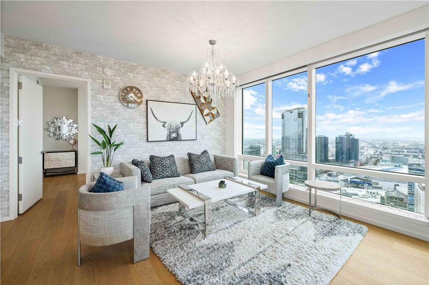 MUST SEE NEW 2 bed/2bath corner unit on the 41st floor of Tower II at Metropolis! The house is fully furnished. 2 blocks from L.A. Live and STAPLES Center in DTLA. This beautiful unit is surrounded by towering window walls capturing far-reaching, multi-directional views of the city skyline and surrounding hillsides. Two bedrooms include a gracious master suite with walk-in closet and spa-like bath. Contemporary details include Caesar stone countertops, custom wood cabinetry and Miele & Bosch appliances in the gourmet kitchen, as well as Nest Learning Thermostats, and 6" wide oak flooring as well as high ceilings throughout! Residents of Metropolis have access to an abundance of resort-style amenities, including 24/7 lobby attendant, concierge service, residence clubhouse, resort-style pool, sky garden, fitness and yoga studio, billiard, game and screening rooms, children's playground, putting green and dog park. Luxury high-rise living at its finest!!!