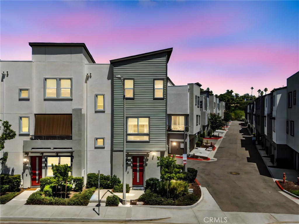 Welcome to Citron, a stylish townhome community built in 2019 in the heart of South Escondido. This modern corner-unit offers 2 spacious bedrooms, 2.5 bathrooms, and an attached two-car garage. The open-concept main living area features upgraded flooring, designer paint, and a sleek kitchen with quartz countertops, stainless steel appliances, and ample cabinetry. Both bedrooms are located upstairs, each with en-suite bathrooms and generous closet space. Enjoy energy-efficient features like dual-pane windows, central A/C, and in-unit laundry. Located in a quiet, well-maintained community with amenities including a dog park, BBQ area, tot lot, and walking paths. Just minutes from shopping, dining, Kit Carson Park, and easy freeway access. Ideal for first-time buyers, downsizers, or investors—this turn-key home is the perfect blend of comfort and convenience. FHA & VA APPROVED!