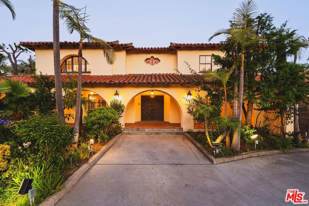 Situated on one of the most coveted streets North of Montana, this original Spanish-style residence offers over 4,300 square feet of living space on an exceptional 15,626 square foot corner lot, just steps from the ocean and Palisades Park. Rich in character, the home features charming architectural details including arched windows, vaulted ceilings, Spanish tile, warm wood accents, and an abundance of natural light throughout. The chef's kitchen is outfitted with Sub-Zero and Miele stainless steel appliances, marble countertops, and generous cabinetry. A breakfast nook adds functionality for daily living, while the formal dining room comfortably accommodates eight and flows into the home's main entertaining areas, complete with a built-in wet bar. The expansive primary suite is a true retreat, complemented by a generously sized bathroom. Additional bedrooms are spacious, with thoughtfully designed bathrooms ideal for family or guests. Outdoors, enjoy the private, flat grassy yard perfect for year-round gatherings, alongside a sparkling dipping pool perfect for year-round SoCal living. A three-car garage and spacious circular driveway provide both convenience and curb appeal. A rare offering on a large corner lot in one of Santa Monica's most sought-after neighborhoods, this is truly a must-see.