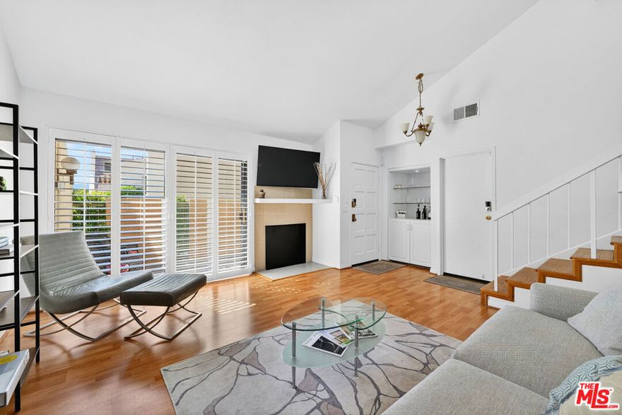 Discover modern comfort and style in this beautifully updated end-unit townhome in Tarzana's Villa North community. Featuring 3 beds and baths, this spacious residence spans approximately 1,516 sq. ft. of light-filled living space. This light-filled residence offers a split level  open living space design with high ,recessed lighting, and a large private patio. The updated kitchen includes granite countertops and new GE appliances. Two bedrooms with private en-suite baths are located upstairs; the primary suite overlooks the lush central courtyard and includes a separate vanity area and a generous walk-in closet with custom shelving. Enjoy an oversize  2-car garage with direct access, side-by-side laundry, EV outlet (Tesla compatible), and recently upgraded electrical panel. With its pristine landscaping, Villa North offers gated entry, security cameras, pool, rec room, and low HOA with EQ insurance. Prime Tarzana location close to Ventura Blvd, dining, and freeway access. Turnkey and move-in ready.