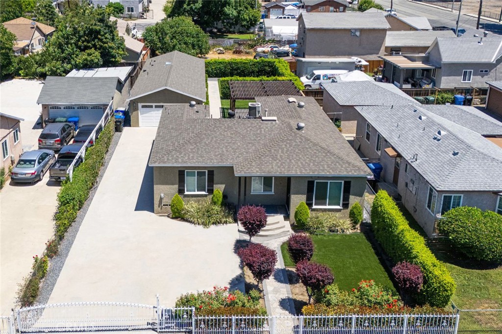 Stunningly 3bd Home plus ADU & JADU investment or owner-user opportunity! This beautifully upgraded property totals 2,085sf, comprised of a front 3/2 house, a 1/1 ADU, and a studio JADU—thoughtfully remodeled with high-end finishes and modern systems - In 2023, New Roof, 400 Amp Electrical, All Copper Plumbing, New Sewer Lines.
The main 3/2 house is 1,184sf and is bright & airy throughout, featuring real hardwood flooring, dual pane windows w/ blinds, recessed lighting, and central air/heat. The stylish kitchen offers shaker cabinetry, quartz countertop, stainless steel appliances, a custom tile backsplash, and sleek black modern finishes. Both the primary & hallway baths have been tastefully remodeled, and all the bedrooms are spacious and equipped with ceiling fans. Ample natural light, generous storage, and dedicated laundry area complete this upgraded home.
The 645sf ADU and 256sf JADU will be delivered vacant, and both offer spacious layouts with an open concept kitchen that flows into big living areas with luxury vinyl flooring throughout, sliding doors, recessed lighting, mini split AC units; and each with full bathrooms with cute vanities, custom tiles, and big walk in showers.
On an impressive 7,631sf lot zoned R3, the front & back yards have been impeccably landscaped with artificial lawn, drought tolerant plants, and a beautiful pergola on a nice concrete pad for the ultimate common area to relax and host gatherings. Other notable features include tankless water heaters, separate electrical meters, drip irrigation system, an automated gate for added security, an extended driveway for maximum parking, and a 2 car garage that will also be delivered empty for a new owner.
Situated in a quiet Pomona neighborhood near Washington Park Community Center, local schools, and just minutes from Downtown, Pomona College, LA County Fairgrounds, and Bonelli Park.
Whether you're looking to live in one unit and rent the others, or seeking a solid income-producing property—this turnkey property is a must-see!