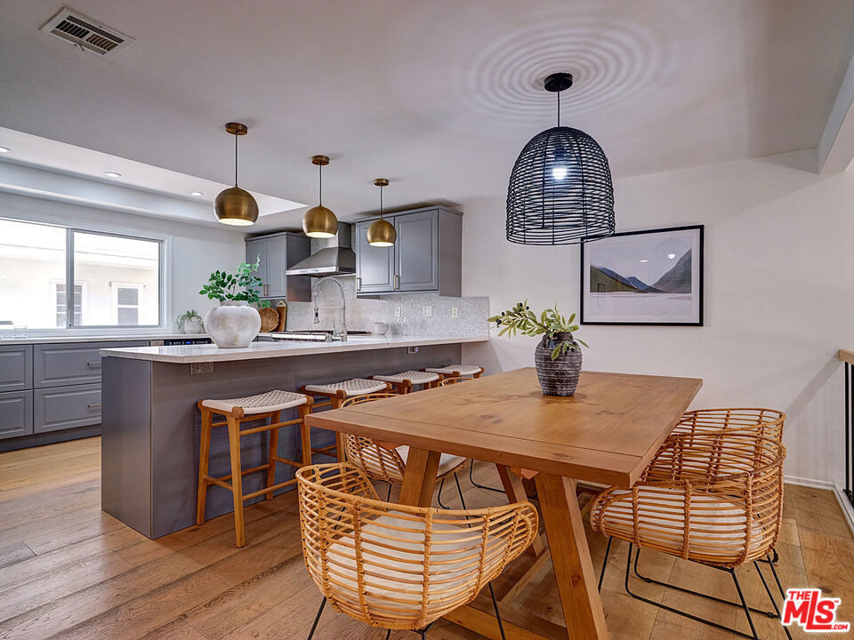 Discover contemporary coastal living in this beautifully designed 3-bedroom, 2.5-bath Marina del Rey townhome featuring bright, open-concept living with soaring ceilings and hardwood floors throughout. The gourmet kitchen boasts gray Shaker cabinetry, white marble countertops, Wolf range, and waterfall-edge island perfect for entertaining. Step onto your private patio oasis surrounded by mature landscaping for ultimate privacy, plus enjoy the charming ivy-covered front entrance. The primary suite includes a versatile bonus room and spa-like bathroom with dual vanity and glass shower. Additional highlights include two-car garage with bonus storage room, resort-style community pool, sauna, and prime location steps from Marina del Rey's finest dining including Pizzana, KazuNori, UOVO, and Sugarfish. A sophisticated retreat offering the perfect blend of luxury, privacy, and convenience. Come and be inspired!