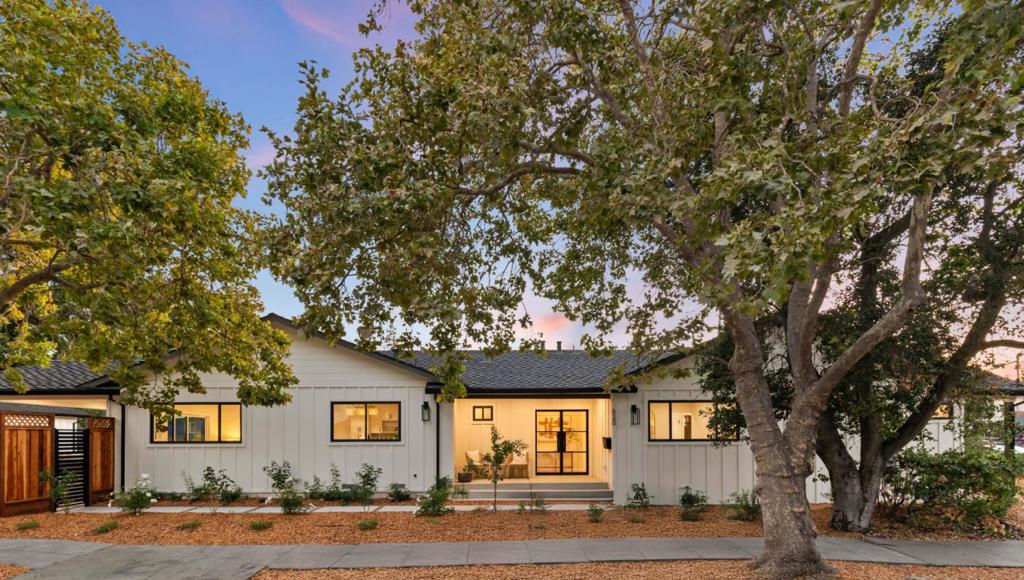 Welcome to 620 Iris, a stunning single-level custom contemporary home in the heart of Redwood City. Step into a vaulted-ceiling foyer that sets the tone for elegance. Situated on an expansive 8,057 sq ft lot, this 4-bedroom, 3.5-bath home offers approximately 2,243 sq ft of thoughtfully updated living space. Features include new electrical and plumbing, luxury laminate floors, recessed lighting, and a tankless water heater. The gourmet kitchen boasts premium Forno appliances, a six-burner gas range, and a large island perfect for entertaining, with picturesque front-yard views. Vaulted ceilings continue through the open kitchen and dining area, flowing to a covered patio and a beautifully landscaped, low-maintenance yard featuring native, drought-resistant plants and a lush lawn - ideal for alfresco dining and play. The spacious great room invites relaxation, while the luxurious primary suite offers vaulted ceilings, dual closets, and an ensuite with dual sinks and backyard access. Additional perks include a dual-zone Nest thermostat, versatile bonus room, abundant storage with a basement and a new detached garage with electric car charger. Close to parks, Whole Foods, downtown, Caltrain, and major freeways, 620 Iris defines refined California living.