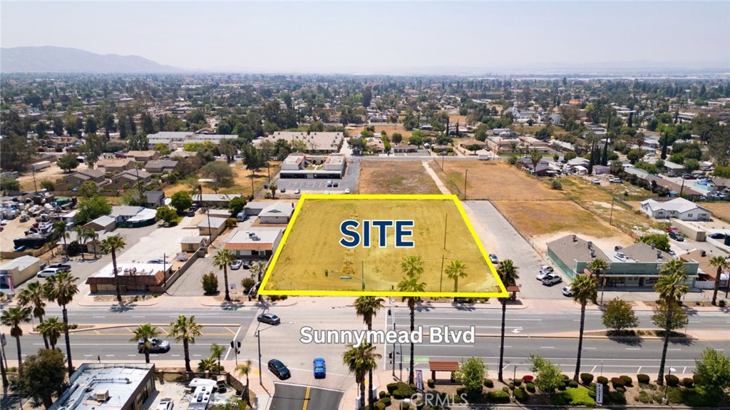 Prime 1.32-Acre Commercial Mixed-Use Development Opportunity in the vastly growing Moreno Valley, CA. Be the one to unlock the potential of this property that is 100% acre flat, fenced and secured, and easily buildable parcel located in the heart of Moreno Valley’s vibrant commercial district. Zoned SP 204 VCR (Mixed Use), the intent for the city is to provide opportunities for a variety of residential, commercial, office, cultural, and recreational activities, offering flexibility for investors or developers. Sunnymead Bl gets approximately ±34,000 cars per day in traffic exposure, as it benefits from high visibility and accessibility. It is also very close to the 60 Freeway. Most offsite improvements such as curb, gutter, and existing Street Lights are complete and already in place, as well as utilities being available to connect into. With the incoming World Logistics Center and surrounding new developments, this area is poised to grow to even greater heights being in the central commercial area with high traffic counts increasing every year. Don't miss this opportunity to develop this great lot on a main street at a stoplight intersection. Buyer to verify any and all marketing information to satisfy themselves. You may see supplements attached for Permitted Uses Table (Look under column "NC" as it is similar allowed uses to SP 204 VCR with some caveats).