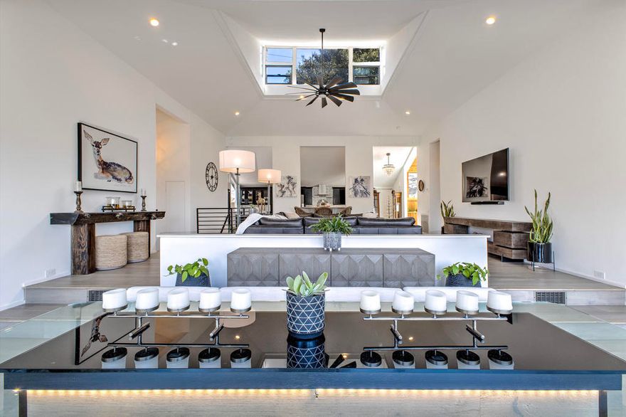 Positioned for sunset and mountain views, and just ashort walk to the village, this 3,442 sq ft home hasbeen fully reimagined with no detail overlooked. Thenew entry solarium with a cactus garden welcomesyou into a space designed for ultimate relaxationor entertainment. Featuring dual primary suites,hard surface floors, a spacious chef's kitchenwith walk-in pantry, and four scenic view decks.Enjoy year-round comfort with central heat, A/C, ahigh-efficiency furnace, and a full-house Generacgenerator. Outdoors, unwind in the hot tub, BBQarea, or beside the waterfall feature. Additionalperks include RV hookups, 400 sq ft of storage, anda fully furnished home with premium pieces, linens,and kitchenware.