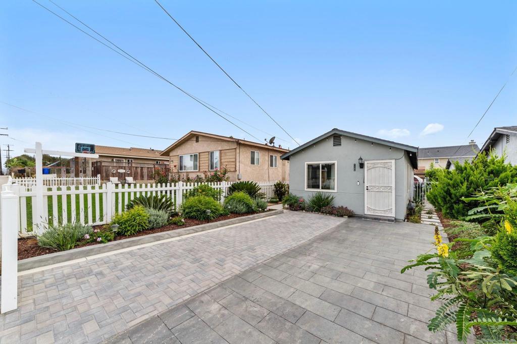 Fully renovated 3BR/2BA in Imperial Beach! Drought-resistant landscaping surrounds this charming home with privacy & curb appeal. White picket fence encloses driveway for 2 cars. Inside features new wood-grain tile floors, quartz counters, stylish standing showers, & fresh paint inside/out. New roof & insulation keep the home cool. Alley access with sliding security gate leads to large rear parking area, room for RV/multiple vehicles. 3rd bedroom has private entry, ideal for rental, guest suite, or Airbnb. Minutes to the beach, dining, & shops!