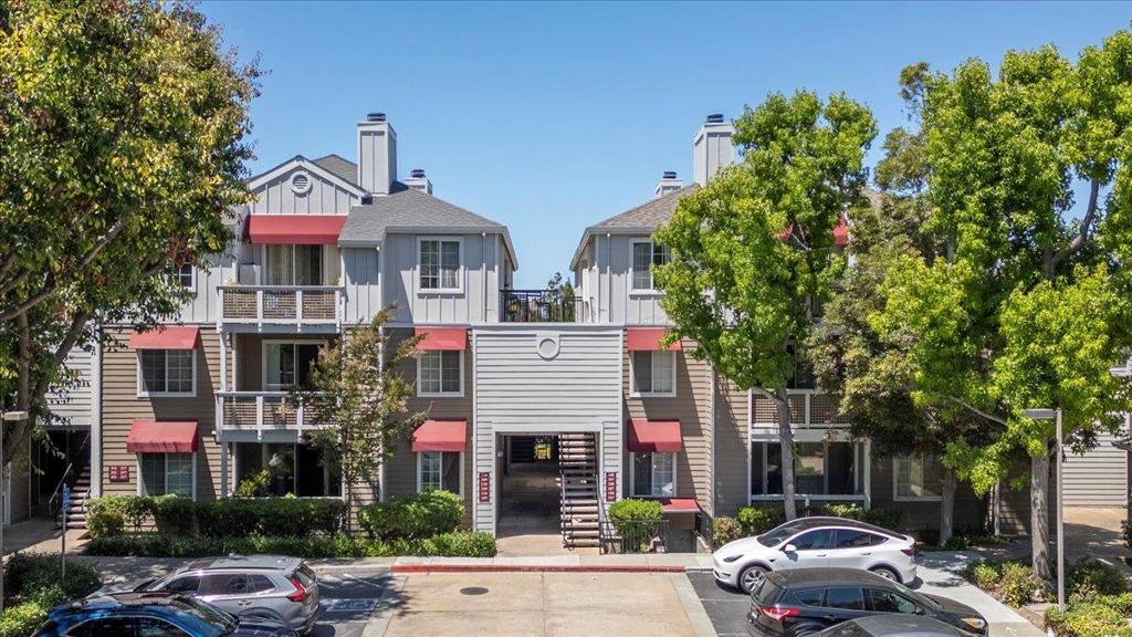 The open layout of this beautiful Silicon Valley condo, complemented by high ceilings, provides an airy and spacious feel throughout. New waterproof LVP flooring and freshly painted interiors create a bright & welcoming atmosphere. The well-designed floor plan offers privacy and convenience with a bedroom, bath, and individual heat zone on each side of the main living area. Both baths updated with gorgeous new quartz counters, sinks & faucets. The primary suite offers dual sinks & dual closets. The open kitchen features a French door refrigerator, a convenient pantry, and ample room for multiple chefs. A full-size washer and dryer make laundry day a breeze. Enjoy the Bay Area weather on your private balcony or out by the pool. With no size restriction on pets, your furry friend is welcome to curl up by the fireplace and call this spot home, too. You'll appreciate the nearby assigned parking spot in the gated underground garage + 2 more parking passes for residents/guests. Plenty of guest parking is available. A private storage space in the garage is included. Garage access is conveniently located right by the base of the stairs. This wonderful unit is situated near Apple, Google, and many other tech employers. Also close to hwys 101, 237, 85, 280, and CalTrain/Light Rail.