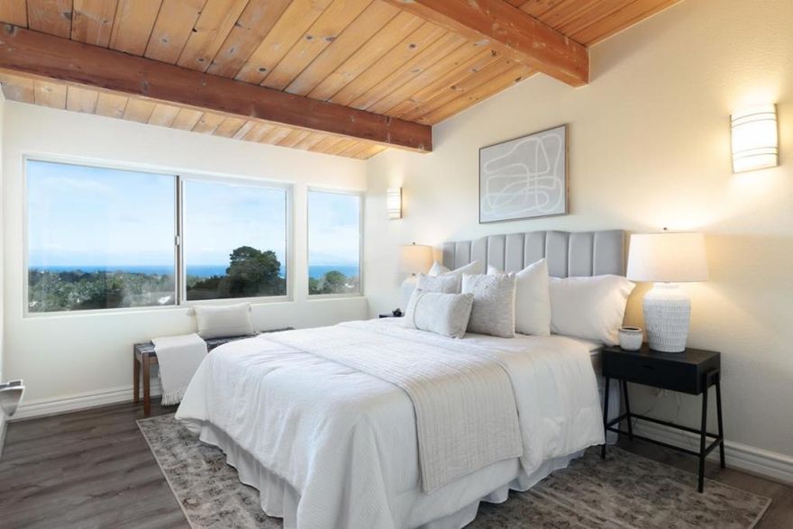 This 2-bedroom, 1.5-bath, two-story condominium offers approximately 954 sqft of well-designed living space, highlighted by broad, open ocean views that feel expansive without trying too hard. From the living room and upstairs bedroom, the Pacific Ocean is always in view while the 700+ sqft Bay View deck delivers a generous, open-air perch that's perfect for sunsets, gatherings, or simply watching the horizon do its thing. Inside, tongue-and-groove wood ceilings, all-new vinyl flooring throughout, multiple windows, and a freshly painted interior create a light, warm, coastal feel that's relaxed yet refined. Everyday conveniences are thoughtfully covered with indoor laundry, on-site storage, and two covered parking spaces, keeping life easy and clutter-free. The location seals the deal. Whole Foods and Elroy's Fine Foods are within walking distance, and beaches, scenic trails, dining, and shopping are just minutes away. Whether you're looking for a weekend escape or a full-time coastal home, this is a place where the views feel substantial, the lifestyle feels effortless, and every day comes with a little extra wow!