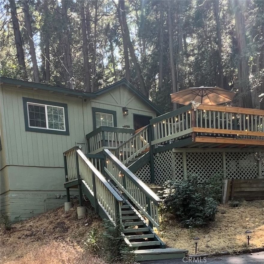 *** REDUCED PRICE***Whether you're seeking a peaceful mountain retreat or a smart investment opportunity, 23995 Scenic Dr. in Crestline offers both. This 912 sq ft home features an updated bathroom, interior laundry hookups, and a spacious deck ideal for outdoor enjoyment. Located just blocks from Lake Gregory, shopping, and dining, you'll appreciate the convenience and charm of the area. The rare lot provides parking for 6–7 vehicles—no street parking required. Additional highlights include a waterless tank and other thoughtful upgrades. Nestled in a quiet, wooded neighborhood, the property offers a tranquil setting with easy access to nearby amenities. Ideal for part-time escapes or full-time living, this home is a must-see.