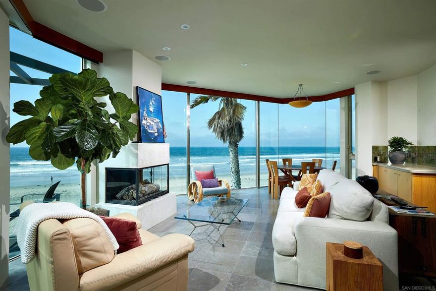 Welcome to your dream coastal retreat! This luxurious oceanfront penthouse condo offers an unparalleled living experience with breathtaking panoramic views of the Pacific Ocean. Perfectly situated on the top floor, this elegant residence combines sophisticated design, modern amenities, & the serene ambiance of seaside living. Floor-to-ceiling windows and expansive terraces provide unobstructed views of the ocean, creating a seamless indoor-outdoor living experience. The open-concept layout features a beautifully designed living & dining area, gourmet kitchen equipped with top-of-the-line appliances, custom cabinetry, & a large island. The master bedroom boasts access to the large balcony, walk-in closet, & a spa-like en-suite bathroom with a soaking tub & rain shower. Additional bedroom is generously sized, each with en-suite bathrooms & private deck. Enjoy stunning sunsets & the soothing sound of the waves from your private rooftop deck with built-in BBQ, ideal for alfresco dining & lounging. Located in the heart of Mission Beach, the condo is close to fine dining, shopping, entertainment, & outdoor activities. Experience the epitome of luxury living in this exquisite oceanfront penthouse condo, where every detail is designed to provide comfort, elegance, and an unmatched seaside lifestyle.