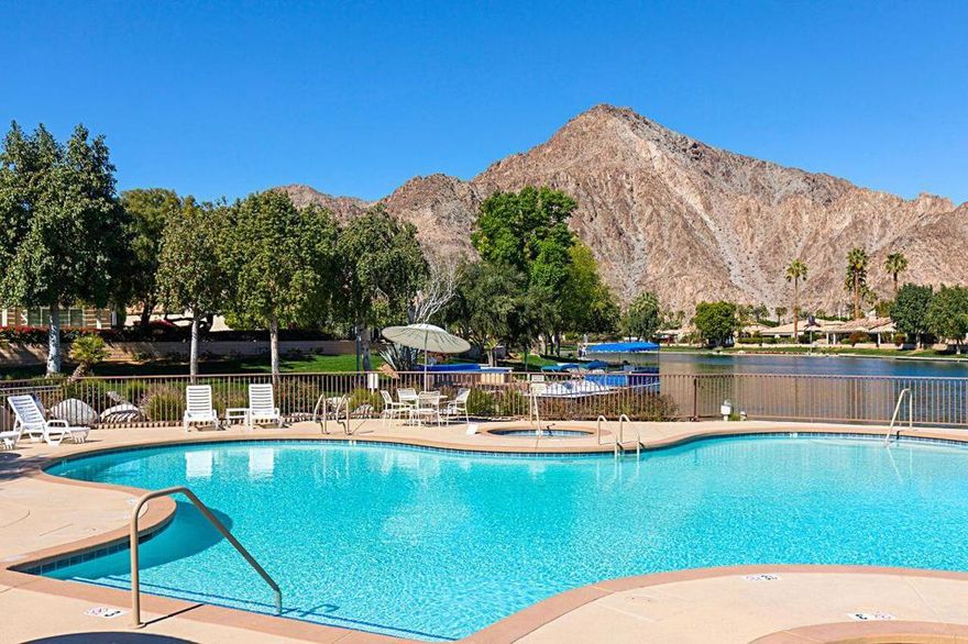 Incredible Mountain ViewProperty - A Rare Gem! This beautiful lake front property in Laguna De la Paz has everything you have been looking for! Featuring breath-taking  mountain views this well-appointed and updated two bedroom, two bathroom home has all the amenities to help you live your dream. The open and spacious floor plan offers approximately 1,562 square feet of livable space, coupled with the best in outdoor relaxing venues. The living room includes a gas fireplace, custom built-in storage and patio access, while the dining area is a plus for everyday meals.. Retire to the primary retreat that boasts a walk-in closet, patio access and a spectacular and luxurious en suite with both tub and seamless glass shower. Guest bedroom is bright and quiet. The real treat is the amazing North and West facing outdoor space that includes a large patio area with a stunning view of the Santa Rosa Mountains.. Laguna De La Paz offers a gated community with amenities that include a fitness center, clubhouse, lake, walking paths, tennis and pickleball courts, pools and spas and more. Fine dining, golf courses and shopping are just minutes away. Professional photography will follow on 10/11/2025