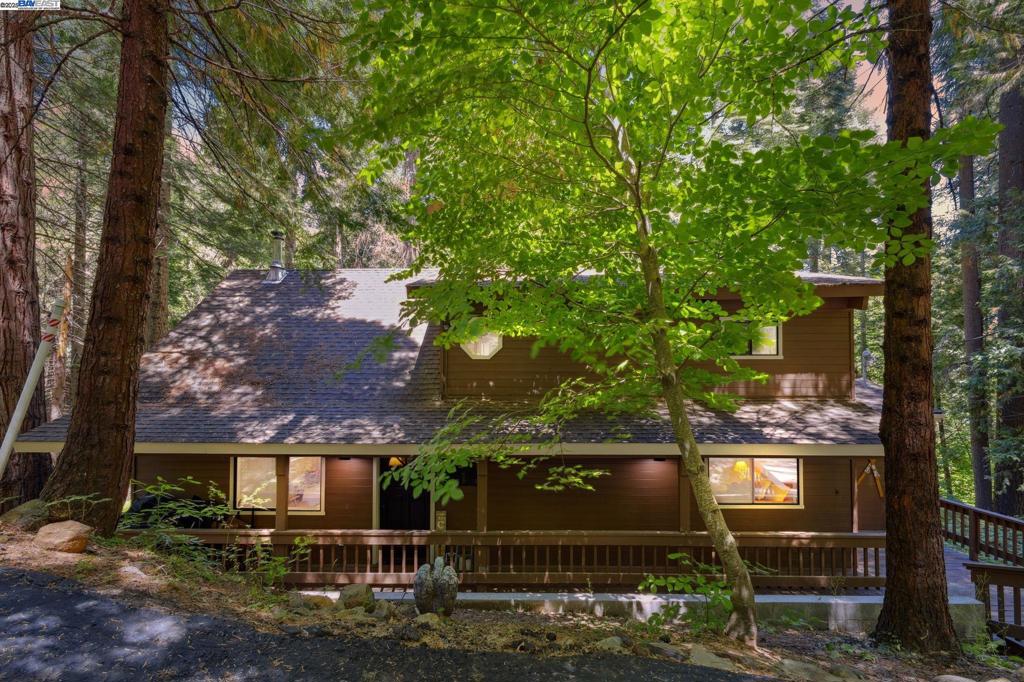 Tucked beneath towering pines in the heart of Arnold, this beautifully maintained mountain retreat blends rustic charm with modern updates in a setting that feels like a storybook. Step inside to soaring vaulted ceilings, an open-concept layout, and walls of windows that flood the space with natural light and forest views. Whether you're cooking up memories in the updated kitchen, unwinding by the cozy wood stove, or relaxing in one of the remodeled spa-inspired bathrooms, this home offers comfort and style in every corner. Cared for with love, this home is truly turnkey—just bring your bags and your favorite people. With ample space to entertain, sleep, and play, it’s the perfect blend of comfort and adventure. Highlights include: Open floor plan with dramatic wood-beamed ceilings Updated kitchen and bathrooms Large deck for stargazing and outdoor dining Peaceful, tranquil setting minutes from trails, downtown Arnold, and Sequoia Woods Golf Course Whether you’re searching for a vacation getaway, full-time home, or your next Airbnb gem—this is the one you've been waiting for. Start your next chapter in the forest. The memories begin here.