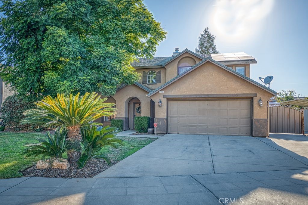 This beautiful home in Clovis features 3 spacious bedrooms, 2.75 bathrooms, and a versatile loft that can easily be converted into a fourth bedroom or home office. Enjoy both a formal living room and dining room, along with a cozy family area that opens to the kitchen—perfect for everyday living and entertaining. The backyard is a true retreat, boasting a sparkling pool, large covered patio, brick fire pit, RV parking, and your very own garden with fruit trees including apples, citrus, and guavas. Additional highlights include a 3-car tandem garage and solar, offering both spaces and energy efficiency.