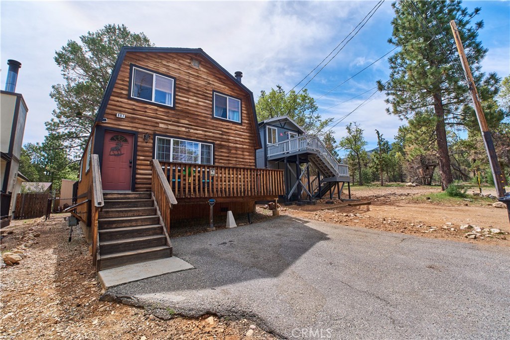 Charming 3-Bedroom Gambrel Cabin Backing to National Forest Welcome to 887 Vista Ave, Sugarloaf, CA 92386 — a warm and inviting 3-bedroom, 2-bath Gambrel-style cabin offering 1,384 sq ft of rustic charm and modern comfort. Nestled at the end of a quiet road and backing directly to the National Forest, this well-maintained getaway is the perfect retreat for nature lovers and outdoor enthusiasts. Step inside to find a cozy, updated interior featuring a beautiful stone fireplace, ideal for relaxing on chilly mountain evenings. The open living area, wood accents, and natural light create a welcoming, lodge-like atmosphere. Recent updates enhance the cabin's functionality while preserving its rustic mountain feel. Just moments away from scenic hiking trails and surrounded by serene forest views, this cabin is the perfect blend of privacy and adventure. Whether you're looking for a weekend escape, full-time residence, or vacation rental, 887 Vista Ave offers a rare opportunity to own a piece of mountain paradise. Don’t let this one get away! This is where you’ll make tons of memories for years to come with family and friends.