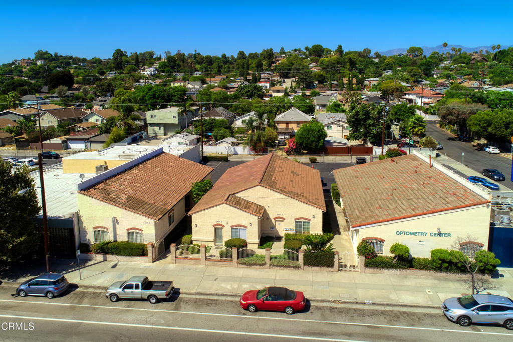 Gated office building with gated parking lot in Highland Park! The complex has three, one-story buildings with Unit B in the center. This unit has its own HVAC, bathroom, front and rear exits, and six parking spots in the rear lot.