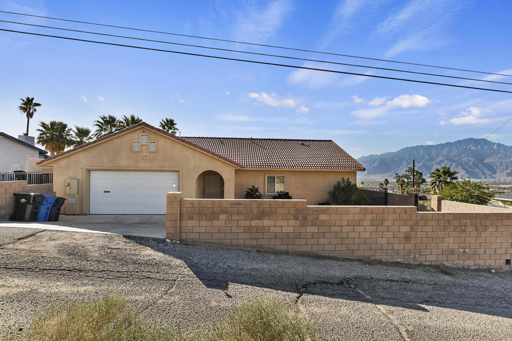High up above downtown Desert Hot Springs is where you want to be!  Majestic views of the Palm Springs Valley below and positioned in a quiet neighborhood in the North/East section of Mission Lakes Blvd!  The interior boasts 3 beds and 2 baths with good separation of rooms along with an open floor plan.  The home has recently been remodeled in both the kitchen and bathrooms.  Laminate flooring throughout with high ceilings along with interior laundry.  The home is well insulated allowing for lower electrical bills year round!  Large two car garage with plenty of storage space.  Front yard has room for a pool should one desire!  This is a beautiful home in a lovely neighborhood.  Only 20 minutes from downtown Palm Springs!