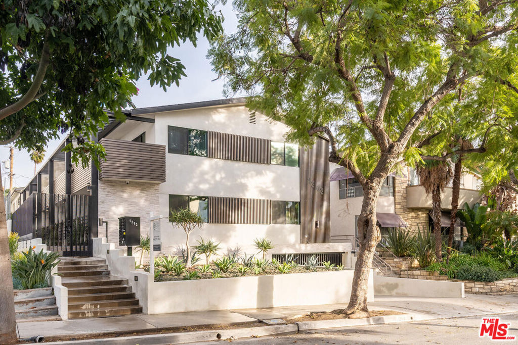 Location is truly everything and this hideaway is in the heart of West Hollywood. Nestled on an idyllic tree-lined street, 1262 Sweezter is a celebration of true boutique luxury- concentrating on luxe modern style and design, while keeping functionality in mind. This fully renovated upper level 2bed/2 bath boosts a large modern kitchen that flows effortlessly into an open concept dining and living space. Kitchen is equipped with marbled quartz countertops, designer cabinetry, and stainless-steel appliances. The kitchen counter seamless stretches into a kitchen peninsula which can double as a perfect at-home work space, equipped with a hidden pop-up USB/charger station. Chic light grey flooring throughout and recessed lighting in addition to the flood of natural light make this unit bright and airy. Two spacious bedrooms with large closets. Master bedroom with en-suite bath. Spa-like bathrooms have walk-in shower, with built-in shower bench offering room to relax and unwind. Washer and Dryer conveniently within the unit. Ample storage throughout. Gated parking. Garage and building secured with exterior surveillance and gated access. EV car charging ports. Situated as central as it gets in Los Angeles, you are just moments from finding the best of all worlds at your fingertips. From world-class shopping, vibrant nightlife, celebrated dining havens, to the best culture and entertainment of West Hollywood and The Sunset Strip.