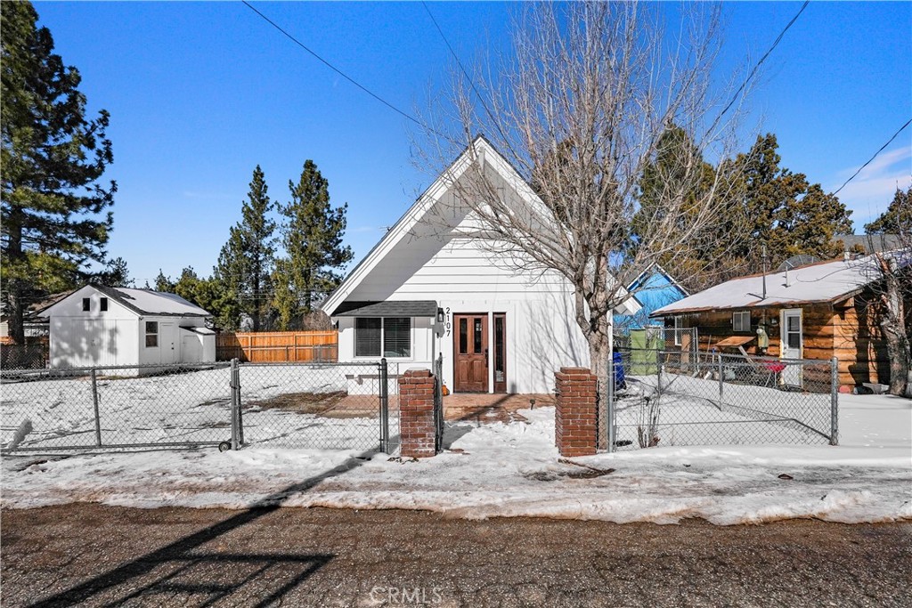 LOCATION! LOCATION! LOCATION! Welcome to 2107 4th Ln. Located in the heart of Big Bear! This beautiful 2 bedroom 1 bathroom home sits on a great size double lot. The interior of the home contains beautiful vinyl flooring throughout, a wood burning fireplace in the living room, and quartz countertops in the kitchen. The amazing size master bedroom is located upstairs. The room contains a bed with a brand new mattress. Main Bathroom is located downstairs and contains a walk-in shower and sink quartz countertop. There is also one more bedroom downstairs that is a great size. Room also contains room decor. The backyard is perfect for entertaining during all seasons of the year, also contains a huge storage unit. Home is close to Bear Mountain and The Village!! THIS HOME WILL NOT LAST!!